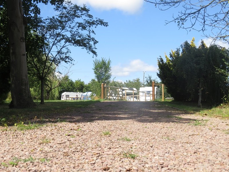 The entrance track leading into the site.