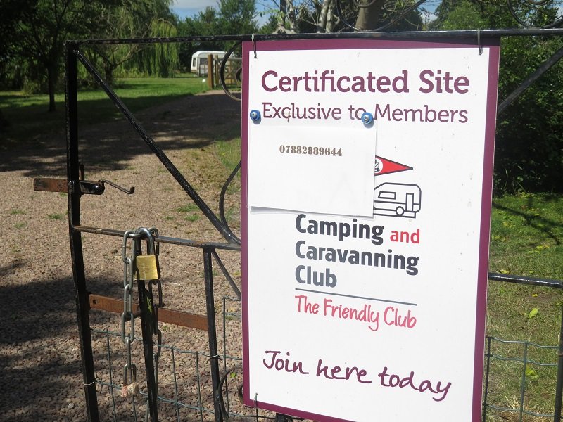 The Camping and Caravanning Club certificated site sign at the entrance.